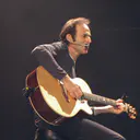 Photo de Jean-Jacques Goldman · Crédits photo Sandrine Joly · Wikimedia Commons